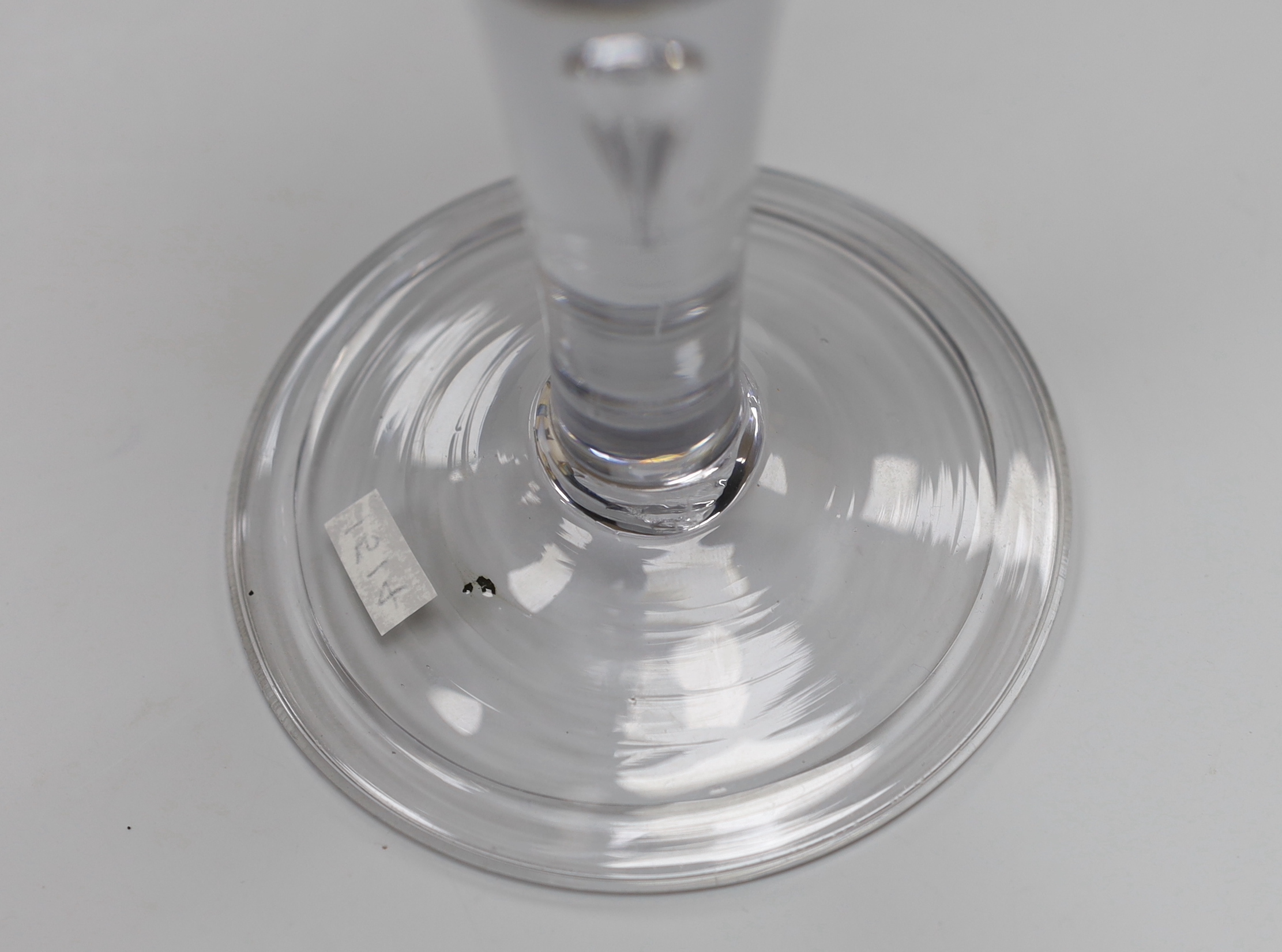 An English Georgian lead crystal mammoth drawn trumpet goblet, with good tear in the stem, folded foot and rough pontil, 21.6cm high